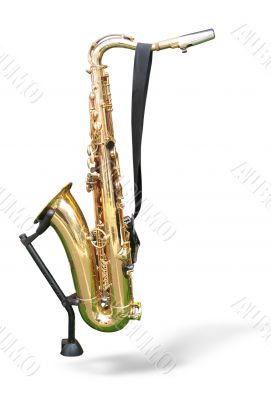 golden saxophone on a support isolated on a white background
