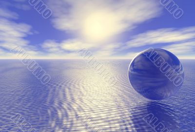 abstract glass globe over blue ocean and sunset cloudy sky