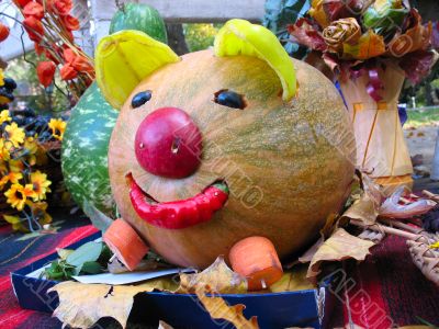 helloween vegetables pumpkin composition concept on yellow leaves flowers and a carpet background