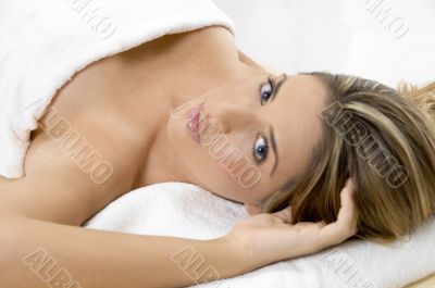 charming young female in towel looking you