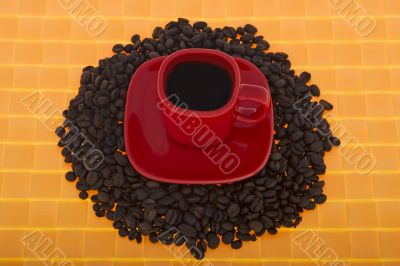 Red cup with coffee beans Red cup with coffee beans