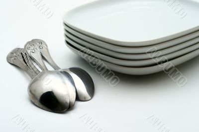 Plates and shining spoons