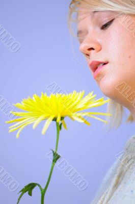 Blond Woman with a Bright Yellow Flower Blond Woman with a Bright Yellow Flower