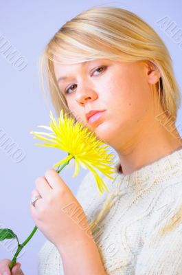 Blond Woman with a Bright Yellow Flower Blond Woman with a Bright Yellow Flower