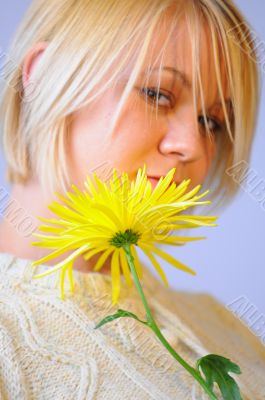 Blond Woman with a Bright Yellow Flower Blond Woman with a Bright Yellow Flower
