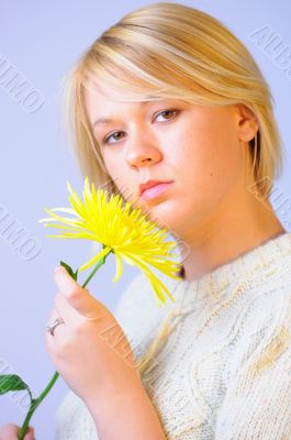 Blond Woman with a Bright Yellow Flower Blond Woman with a Bright Yellow Flower