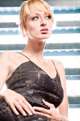 Beautiful blond on stairs looking up