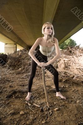 Paris Hilton look-a-like fashion shoot posing with a tree branch