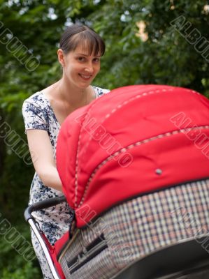 Woman with baby carriage Woman with baby carriage