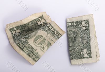 two crumpled one dollar banknotes