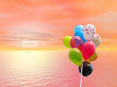 Bunch of colored party balloons against bloody red sunset over ocean