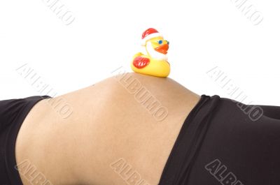30 weeks pregnant teenager with christmas duck on her belly