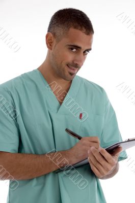 doctor writing on notepad