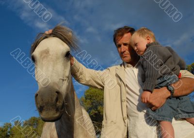 man, son and horse