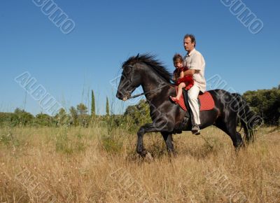 father, daughter and horse