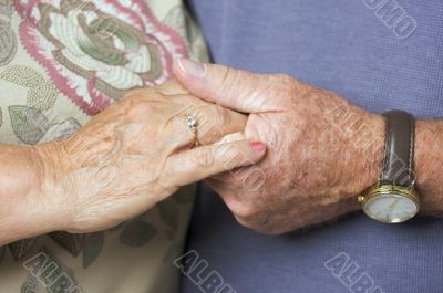 Senior Adult Couple Holding Hands