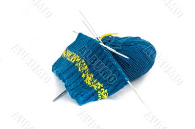 knitting blue pattern and ball of wool