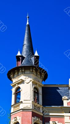 Wing peaked with two windows in the dark blue sky Wing peaked with two windows in the dark blue sky