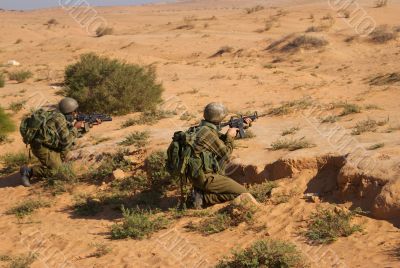 Israeli soldiers excersice in a desert