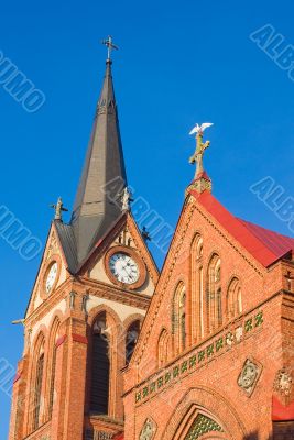 Bird with spred wings on cross