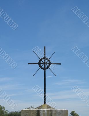 metal cross and blue sky