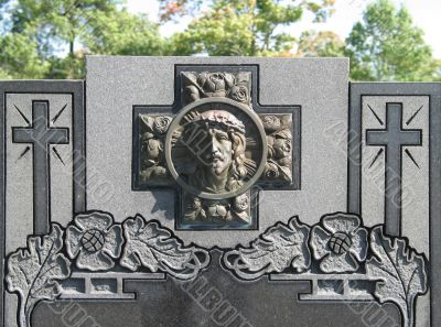 stone tomb with carved jesus