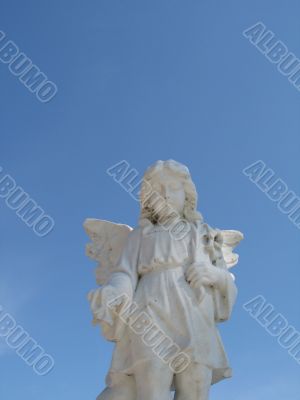 stone angel and blue sky