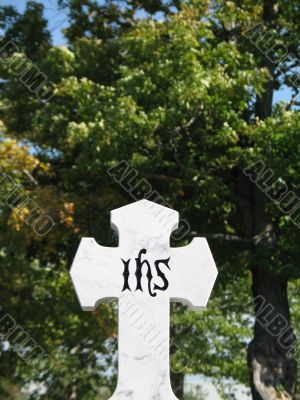 stone cross with tree