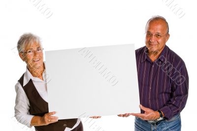 man &amp; woman holding a blank over white background