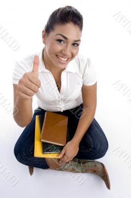 pretty teenager girl posing with thumbs up
