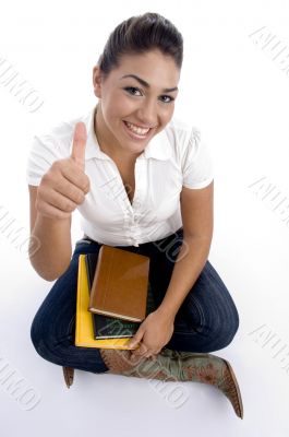 pretty teenager girl posing with thumbs up pretty teenager girl posing with thumbs up