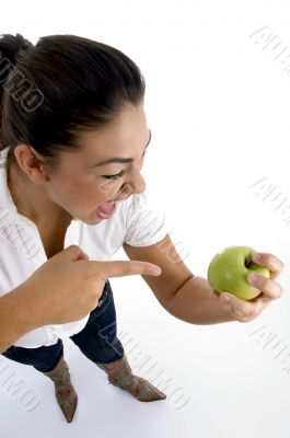 young model indicating the apple