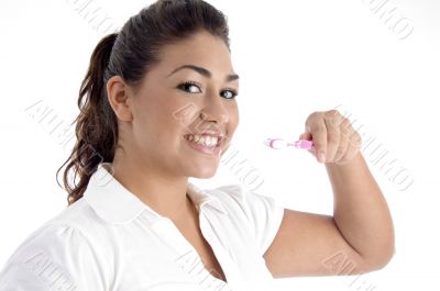 young girl cleaning her teeth