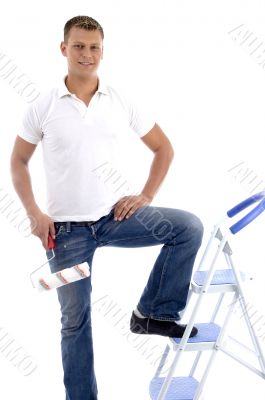 handsome painter standing on ladder chair