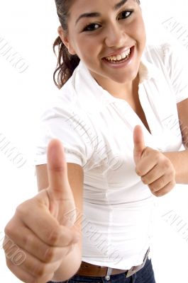 smiling woman showing good luck sign