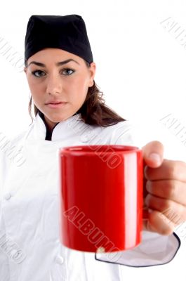 chef showing you coffee mug