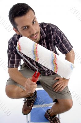 close up view of man holding painting brush