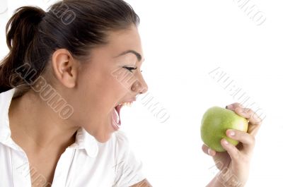 young model going to eat fresh apple