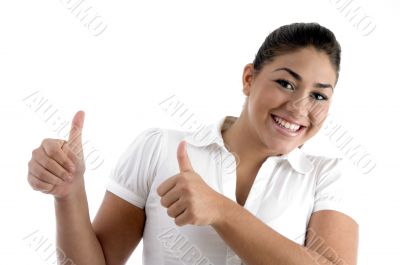 smiling woman showing good luck gesture