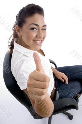 young pretty sitting on the chair and facing