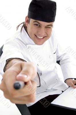 happy male chef posing in front of camera