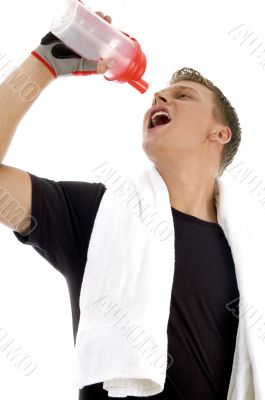 man taking drink while exercise