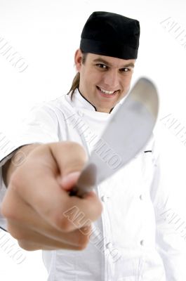 male chef showing kitchen tool facial expressions