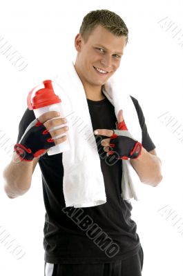 smiling man indicating bottle