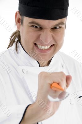 male chef showing kitchen tool facial expressions