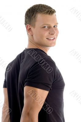 side pose of muscular man