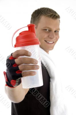 exercising male showing bottle