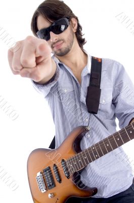 young rock star posing with guitar