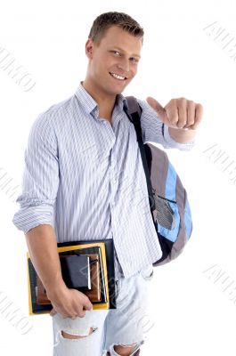 college student with books and backpack