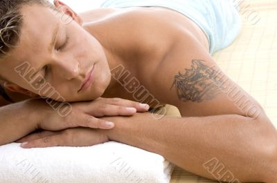 handsome male lying in spa resort